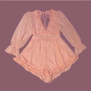 Brand: Lucy In The Sky / Bettina Ruched Ruffle Romper in Pastel Salmon.